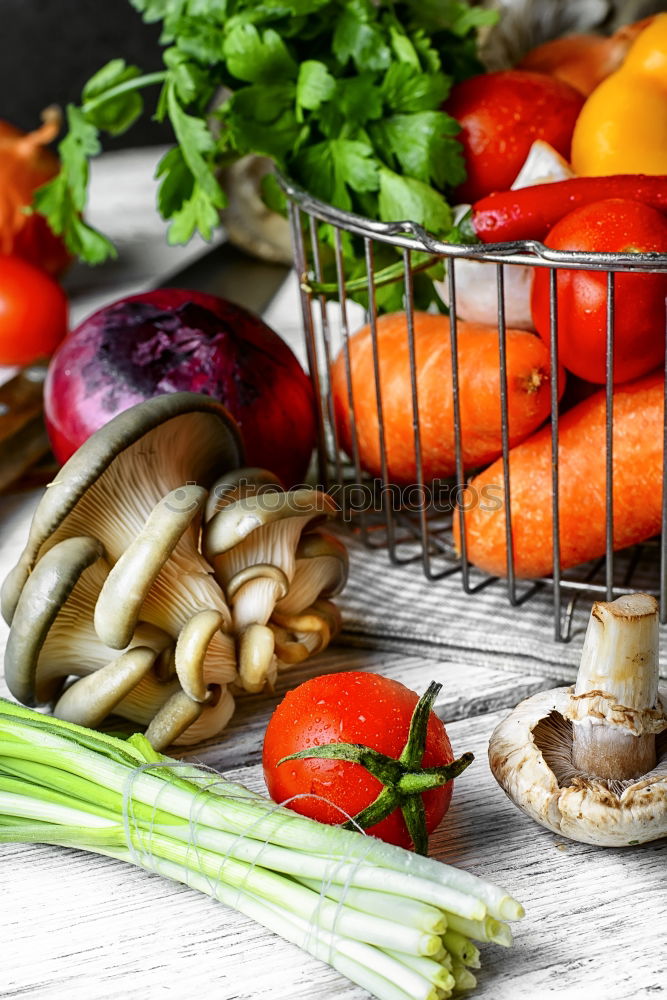 Similar – Vegetables and utensils on kitchen table