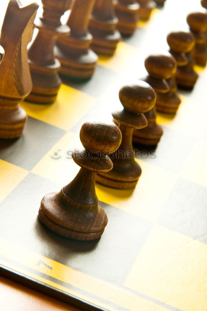 Similar – Girl and boy playing chess at home.