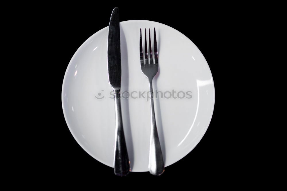 Similar – Half empty white plates, vintage knife and fork