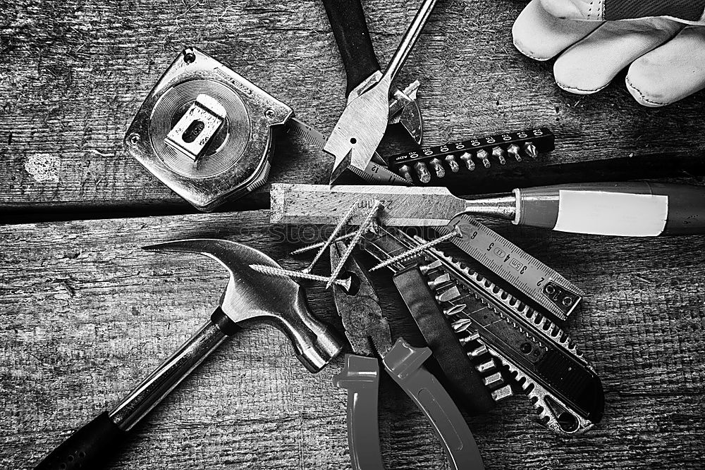 Similar – Top view of different goldsmiths tools on the jewelry workplace.