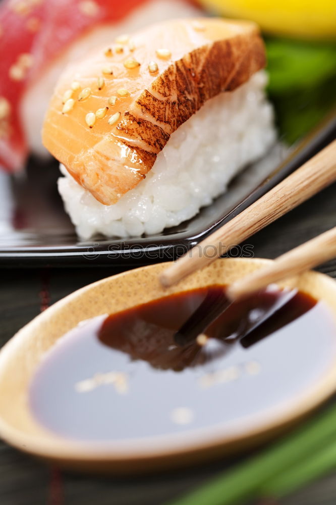 Similar – Image, Stock Photo Sushi set on pottery plate with chopsticks and soy sauce