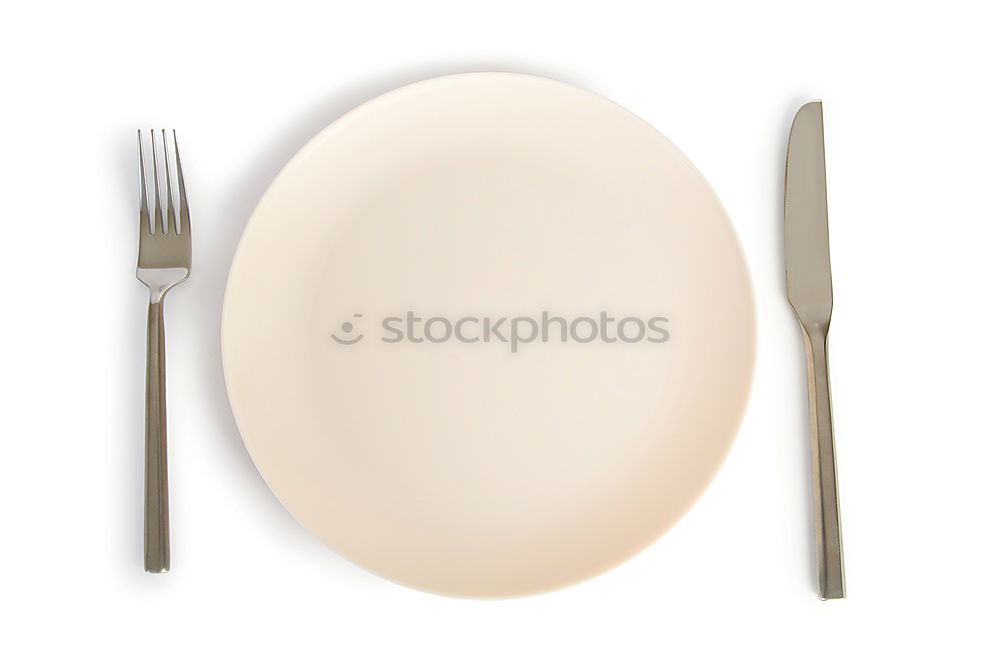 Similar – White dish with iron cutlery