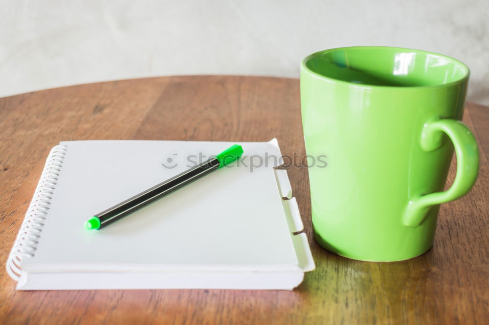 Similar – Green slip of paper with pen, a cup of coffee and a potted plant