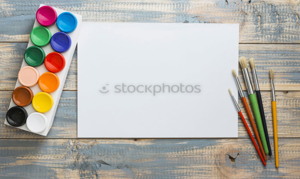 Similar – Garden tools with flower parts on empty notebook .