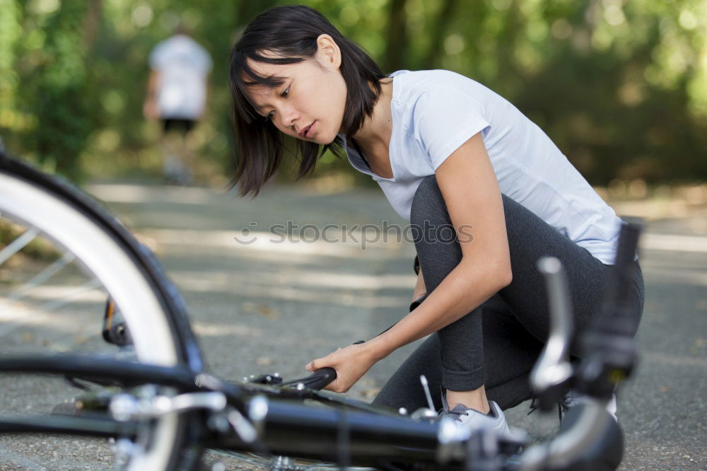 Similar – Foto Bild eine Frau hatte einen Unfall, sie ist mit einem Fahrrad gestürzt und hat sich verletzt