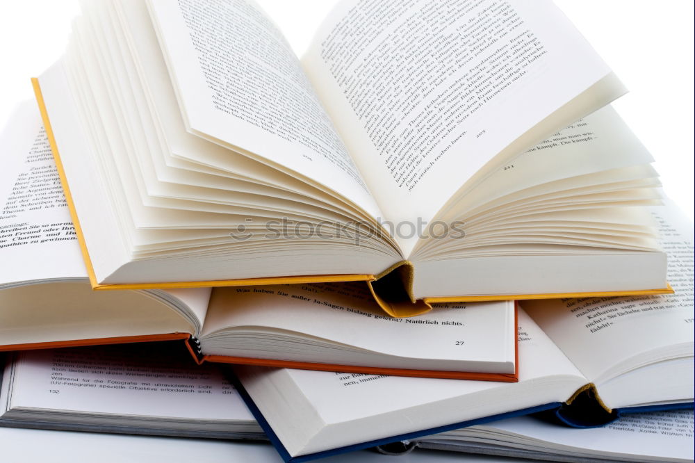 Similar – Woman turning pages of book on table in antique bookstore