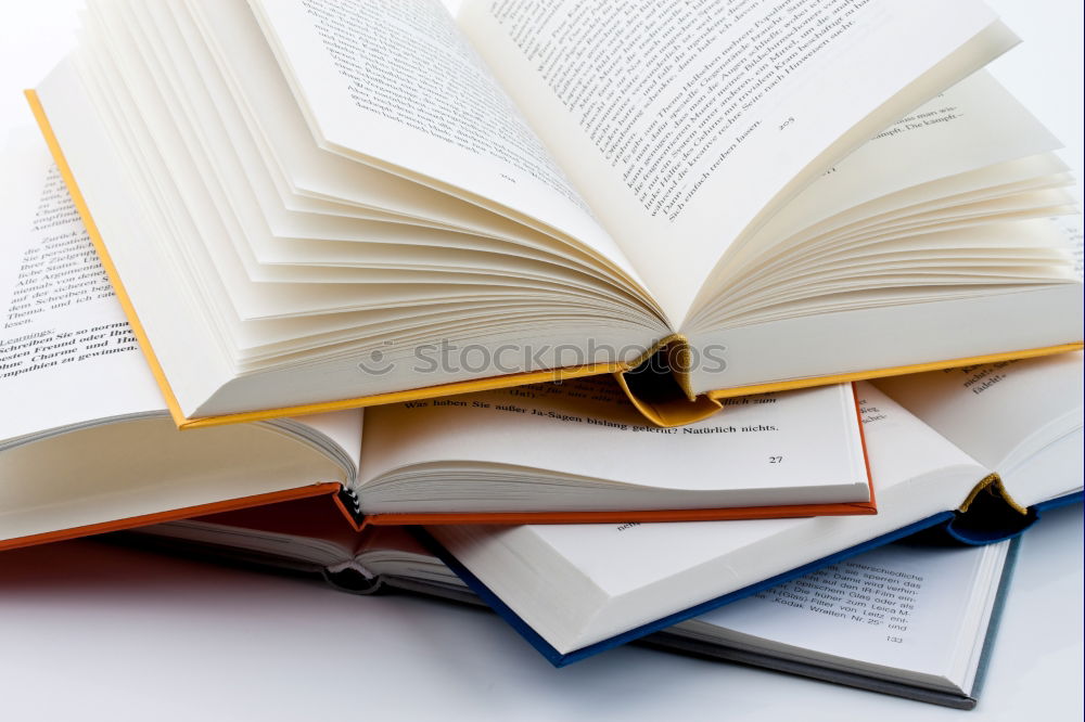 Similar – Woman turning pages of book on table in antique bookstore