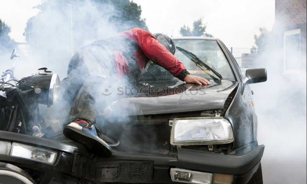 Similar – Professional Mechanic Repairing Car.