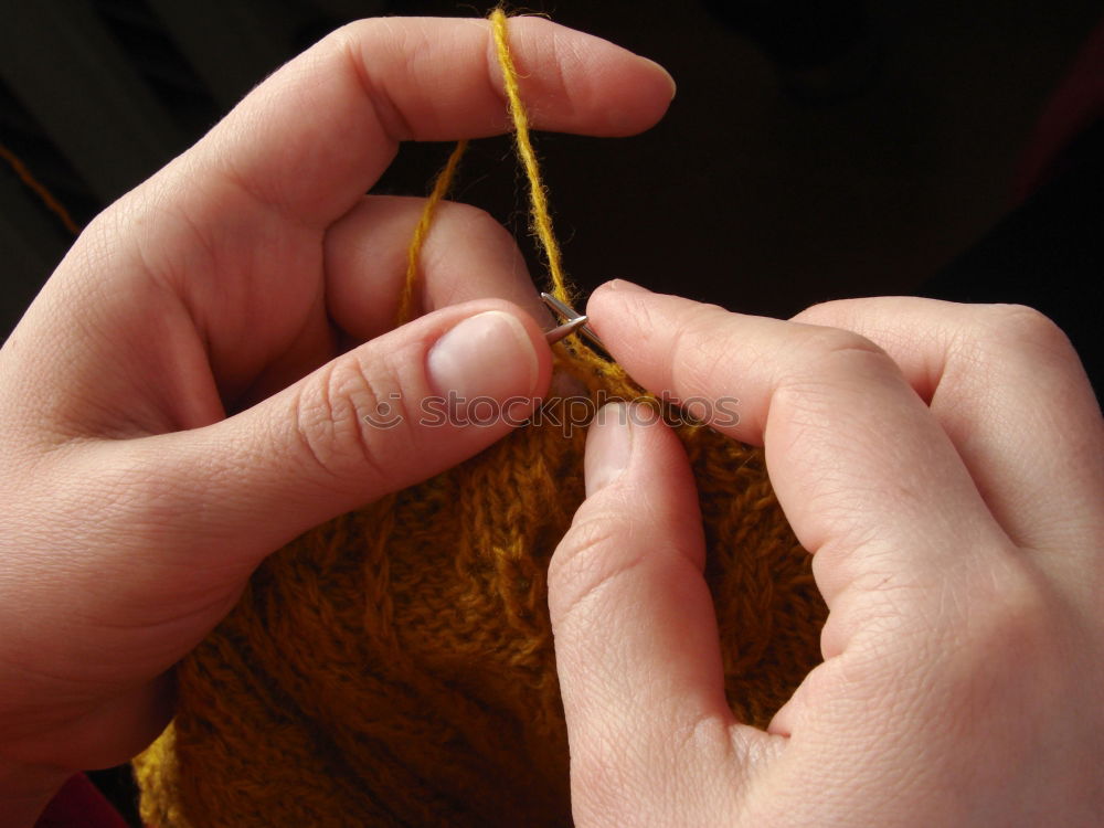 Similar – Close up of the hands of an elderly woman knitting sock