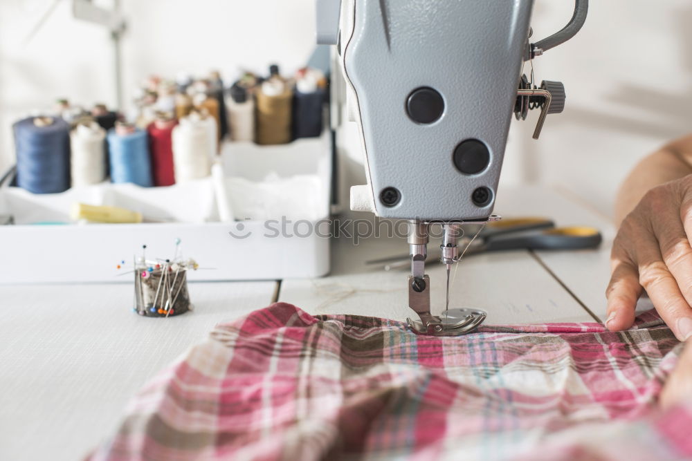 Similar – Image, Stock Photo Woman sewing on a sewing machine