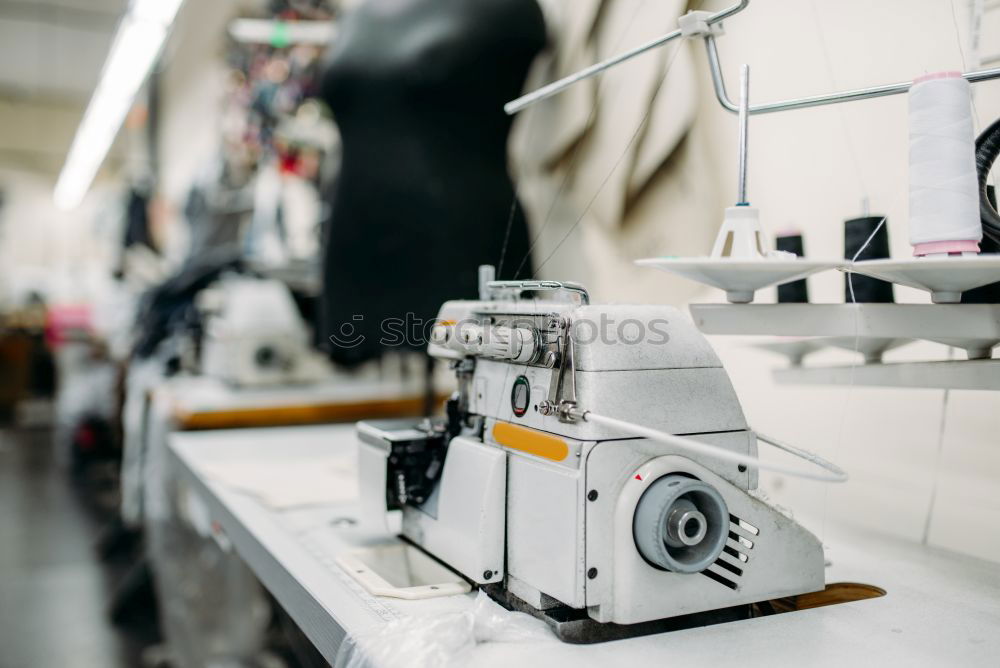 Similar – Image, Stock Photo Desk of fashion designer with sewing machine and tools