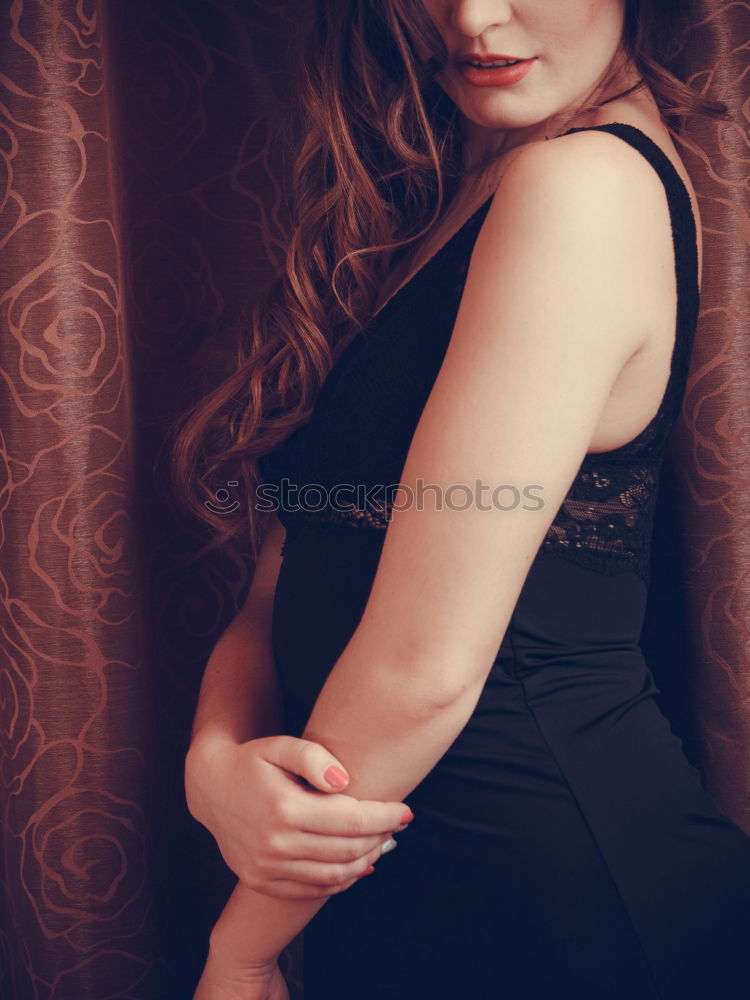 Similar – Image, Stock Photo Young, redheaded woman lies on a flowered sofa and looks sideways into the camera