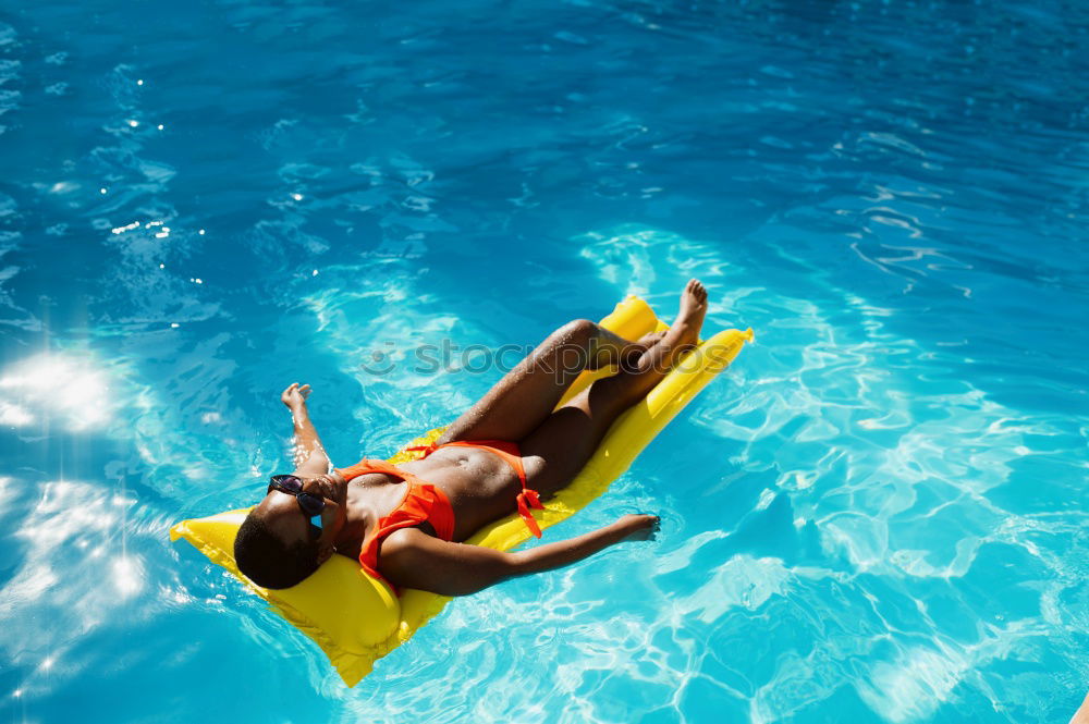 Similar – Image, Stock Photo Woman legs in a swimming pool with lifesaver