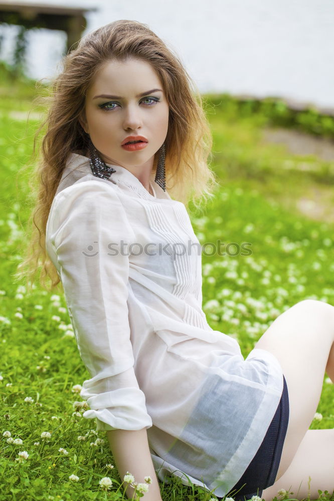 Similar – Image, Stock Photo young woman in summer dress sits among bushes and grass barefoot in nature