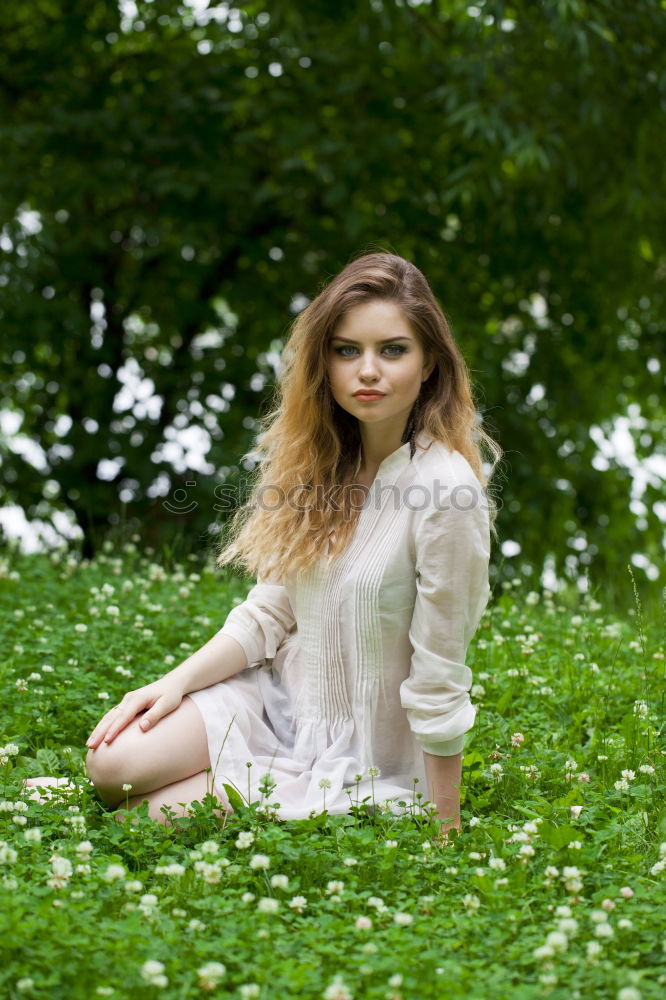 Similar – Image, Stock Photo Young, very athletic woman in skirt and t-shirt sits barefoot on a wooden bench in the forest with her legs crossed