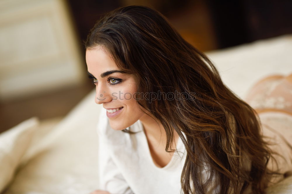 Similar – Image, Stock Photo Young woman smiling and sitting in an urban bar