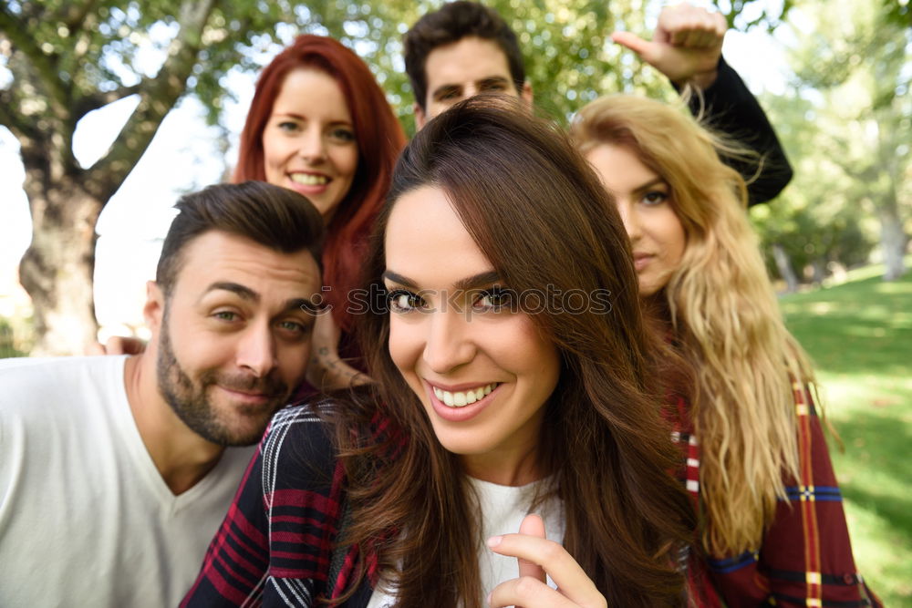 Similar – Group of friends taking selfie in urban park