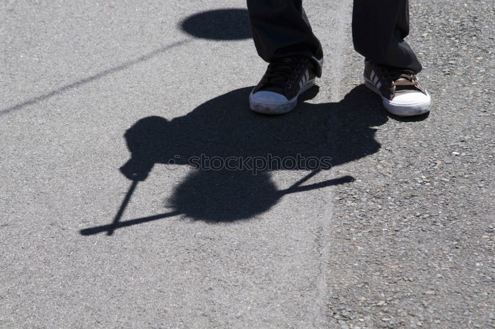 Similar – Schatten von Frau mit Tasche auf Stein