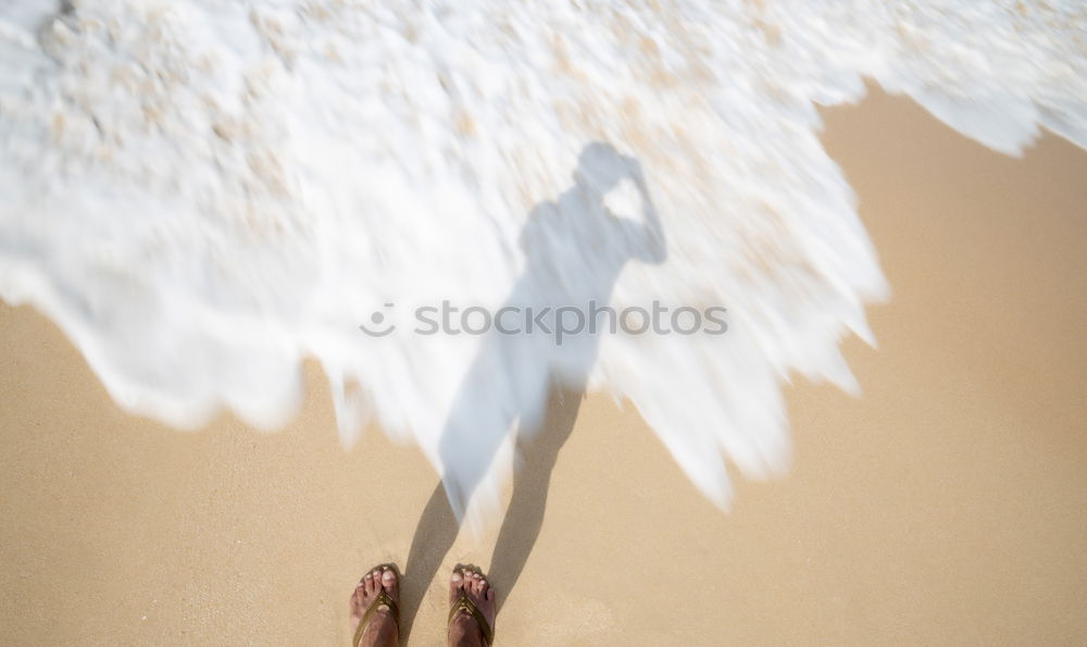 Similar – Crop barefoot woman walking on wet sand