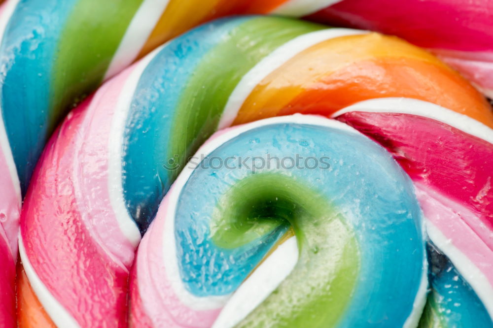 Similar – Image, Stock Photo Colorful lollipops on blue background. Top view.