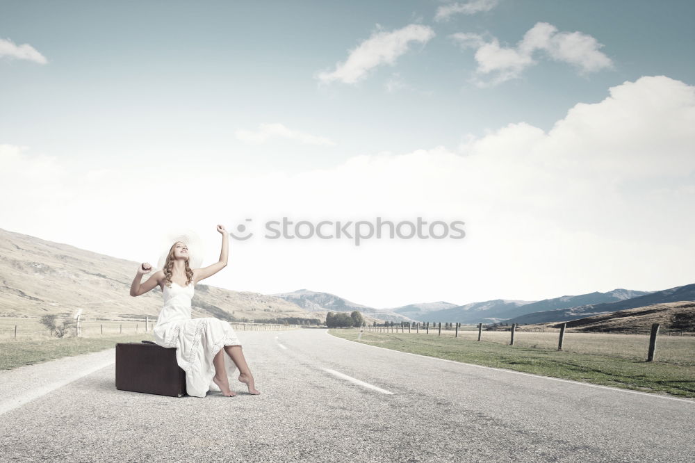 Similar – Boy with suitcase on the road