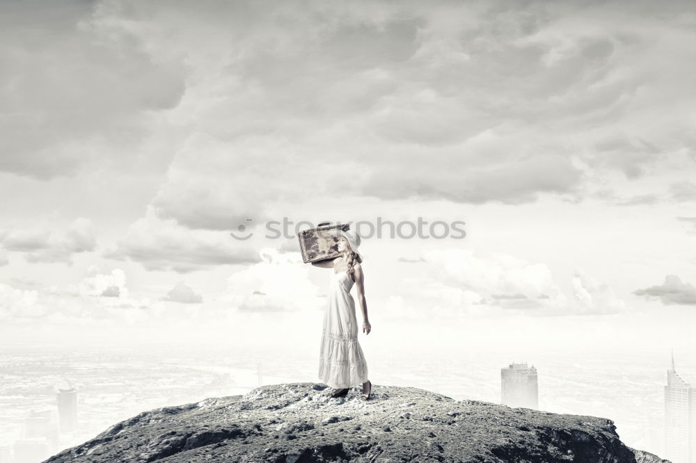 Similar – Man relaxing on cliff