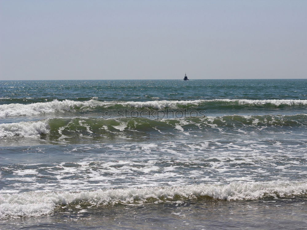 Similar – Steg mit Sonnenschutzdach am Strand bei stürmischer See