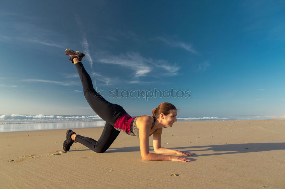 Similar – Adult fitness couple doing exercise together on beach