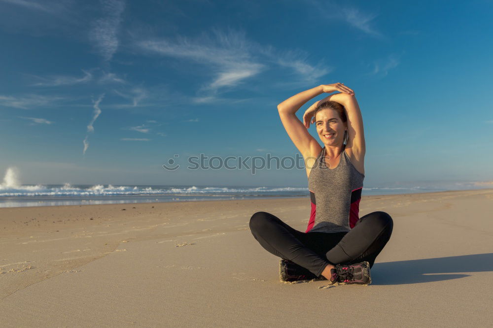 Similar – Woman enjoying the sunset on a beautiful beach