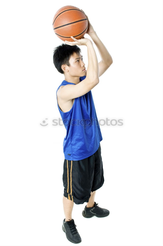 Similar – Teenage playing basketball on an outdoors court