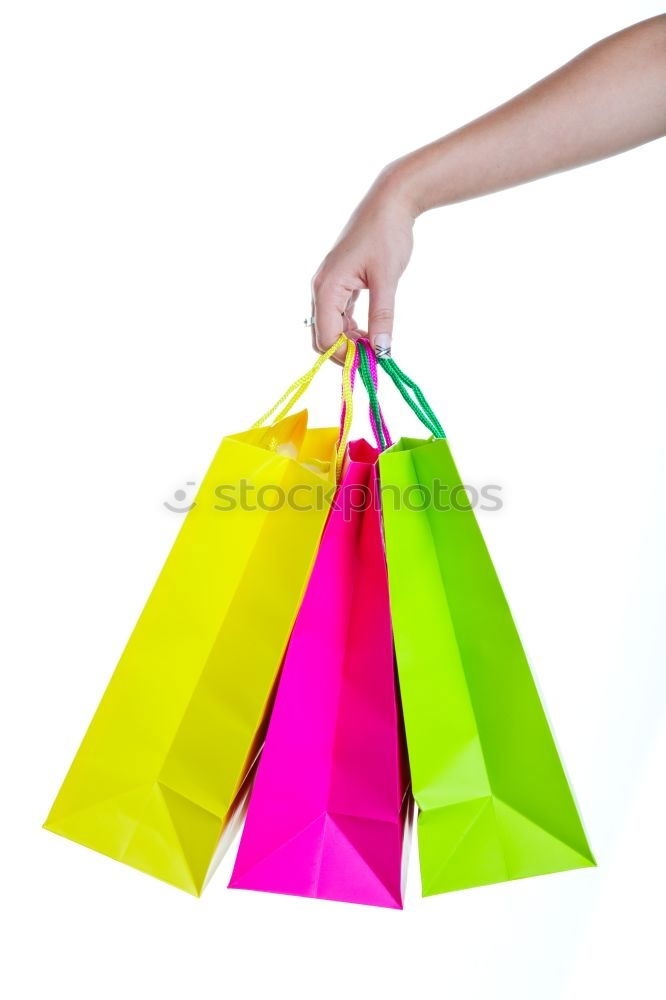 Similar – Shopping bags on womans hand. Woman shopping with colored paper bags.