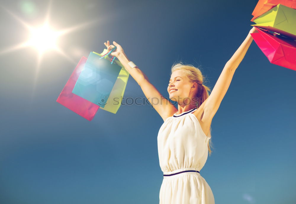 Image, Stock Photo Woman holding the Gay Rainbow Flag over blue sky outdoors