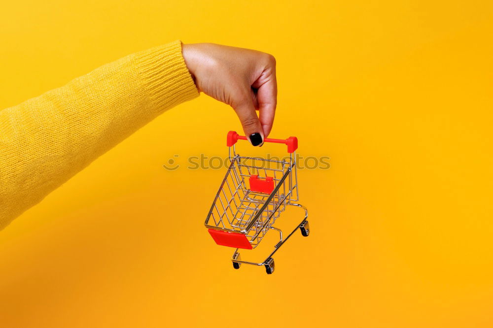 Similar – Image, Stock Photo Close up retail shopping cart over yellow