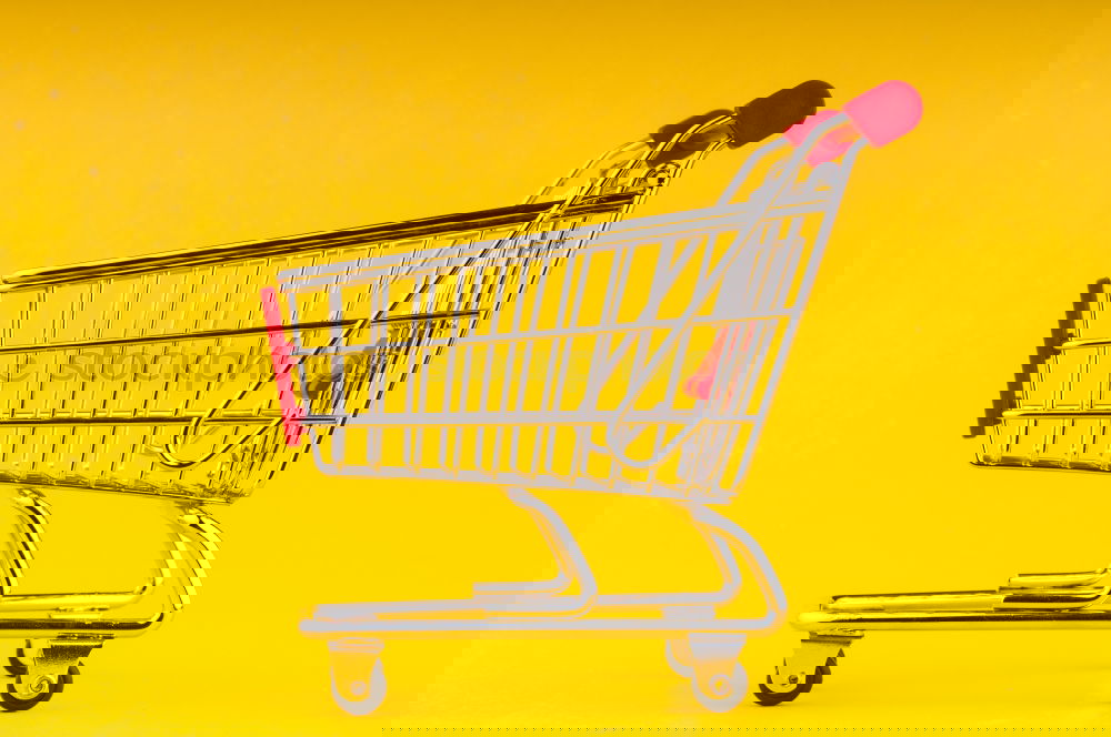 Similar – Image, Stock Photo Close up retail shopping cart over yellow