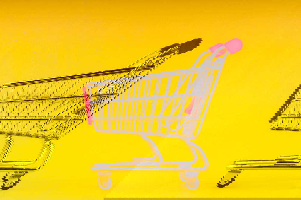 Similar – Image, Stock Photo Close up retail shopping cart over yellow