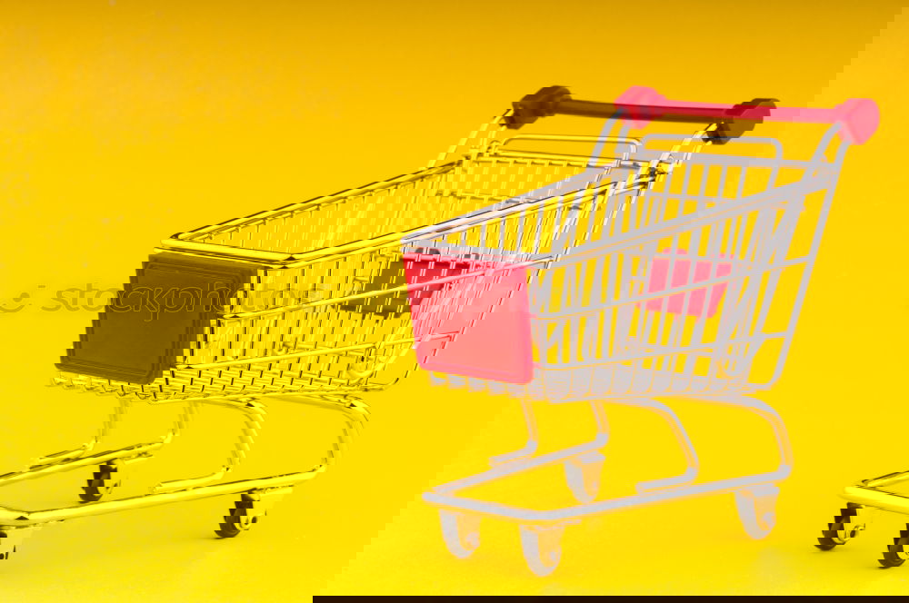 Similar – Image, Stock Photo Close up retail shopping cart over yellow
