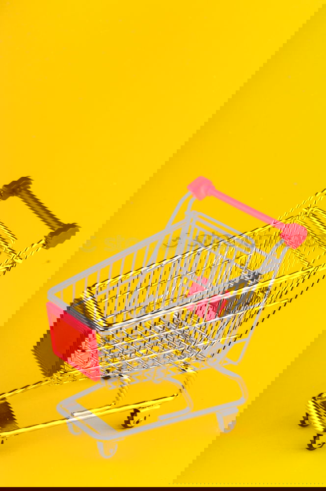 Similar – Image, Stock Photo Close up retail shopping cart over yellow