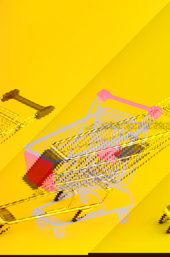 Similar – Image, Stock Photo Close up retail shopping cart over yellow