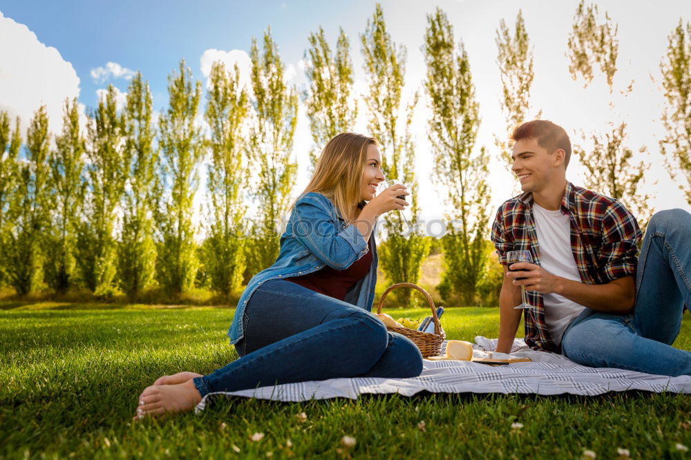 Similar – Couple eating pizza at date night in sunset