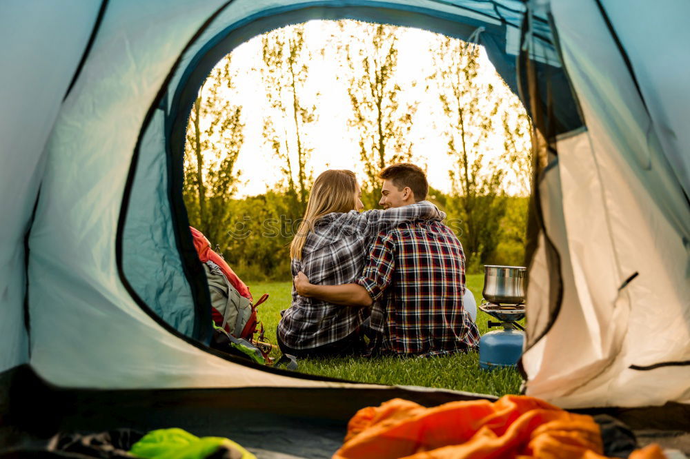 Similar – Couple planning next trip while sitting with map in tent. People relaxing in tent at camping during summer vacation