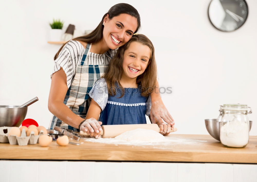 Similar – Image, Stock Photo Little sisters cooking with her mother in the kitchen.