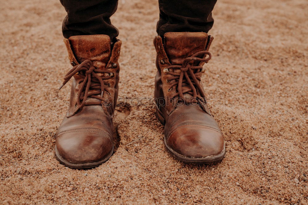 Similar – Image, Stock Photo Legs in leather boots in puddle