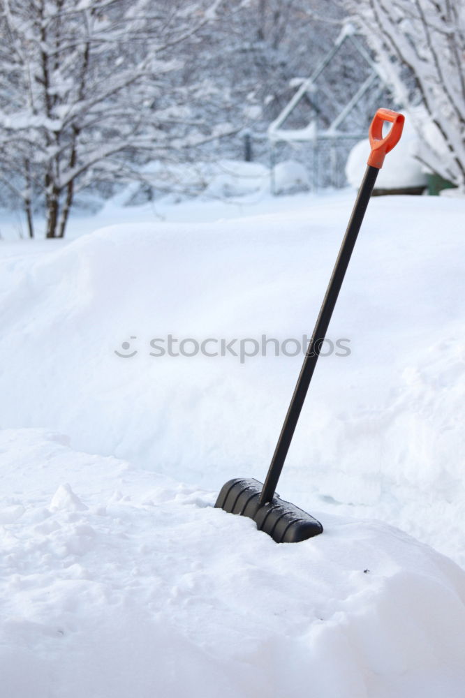 Similar – Schneeschieber, viel Schnee und Kopfsteinpflaster