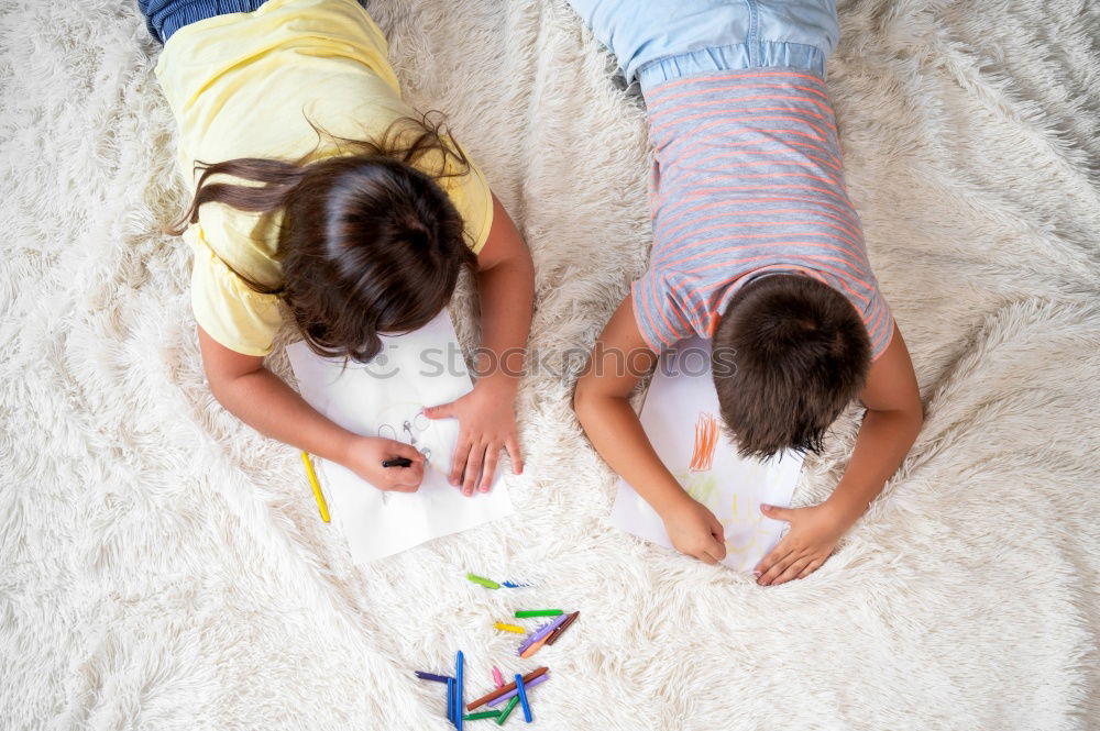 Similar – mother reading book to toddler daughter