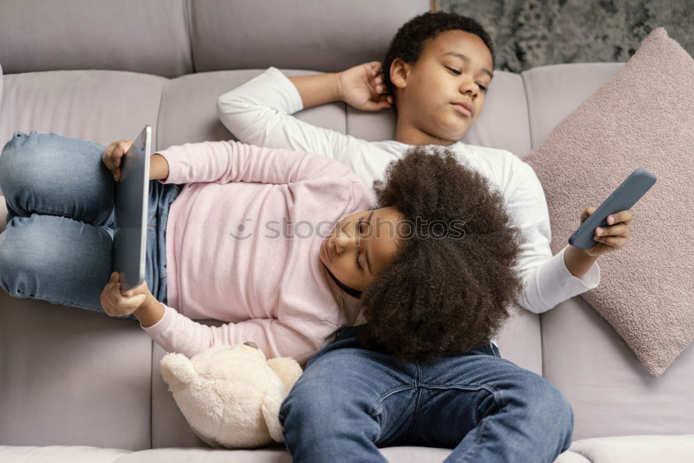 Similar – Happy mom and daughter using digital tablet together