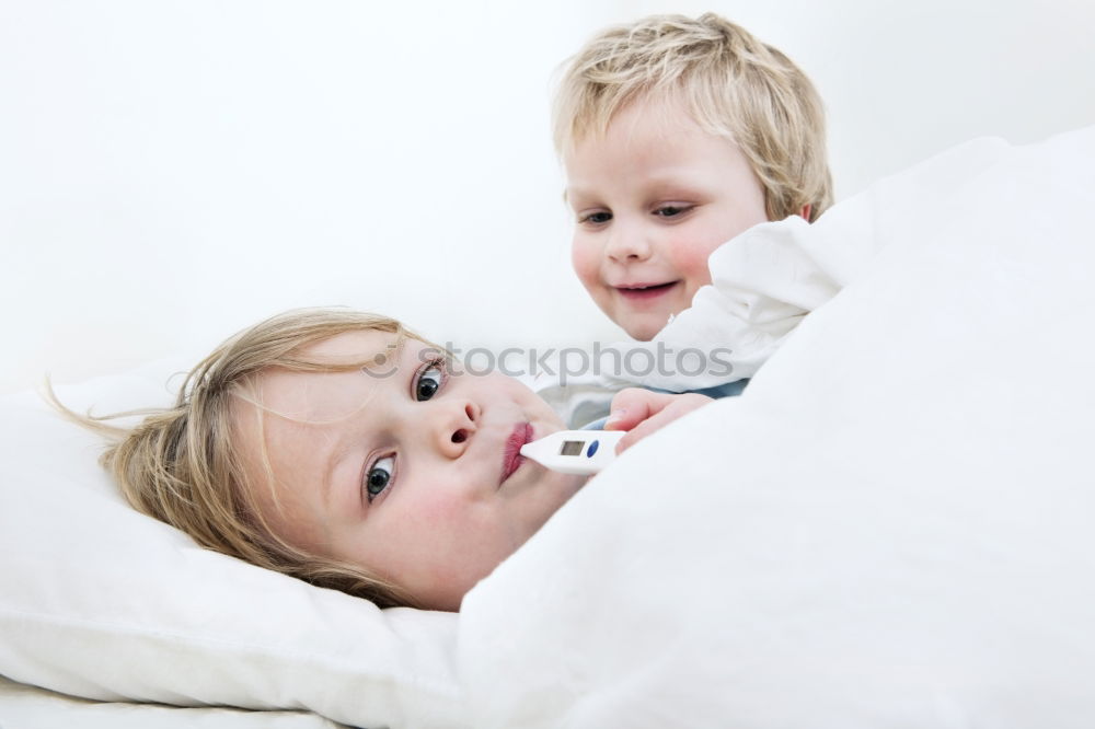 Similar – Two beautiful sisters playing on bed