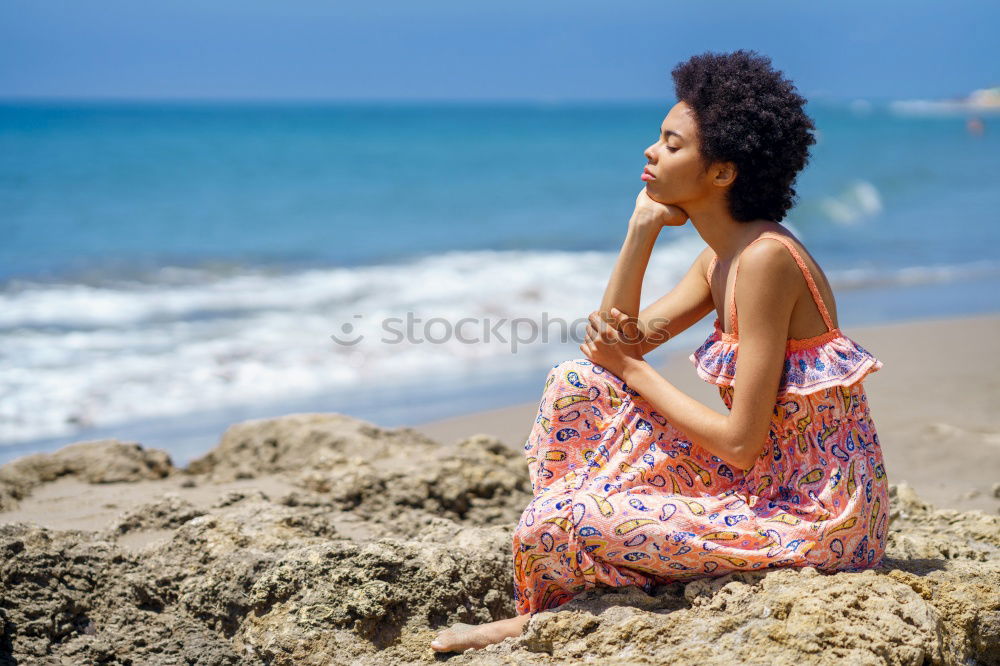Similar – Image, Stock Photo Beautiful young black woman lying down in a  wooden foot bridge at the beach