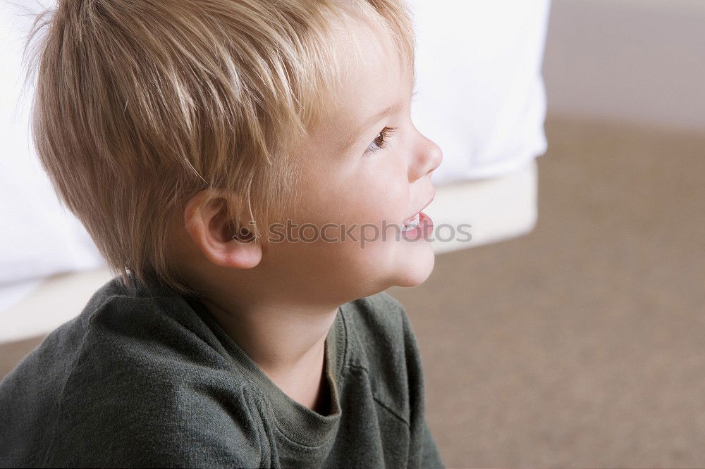 Similar – Toddler boy playing with new toy wearing pyjamas