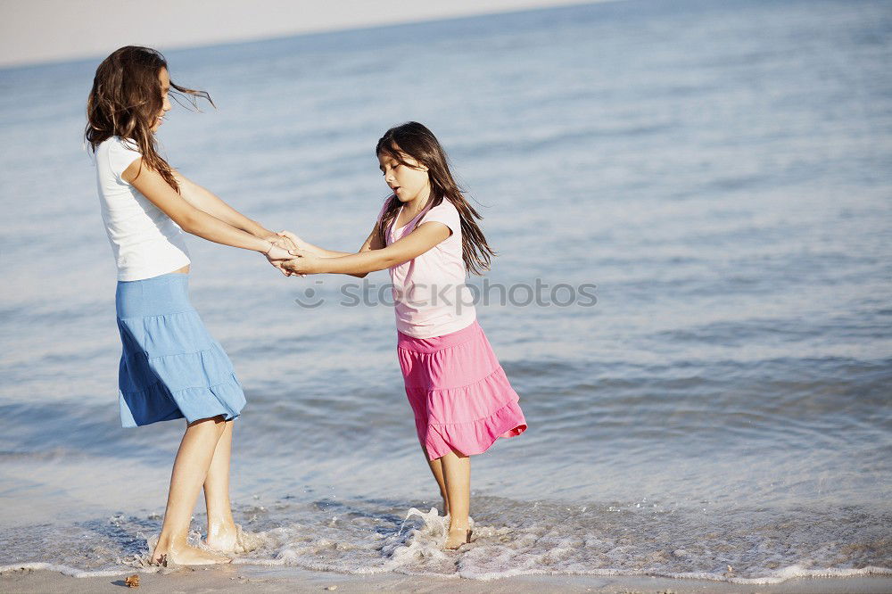 Similar – Image, Stock Photo Mother and son playing on the beach at the day time.