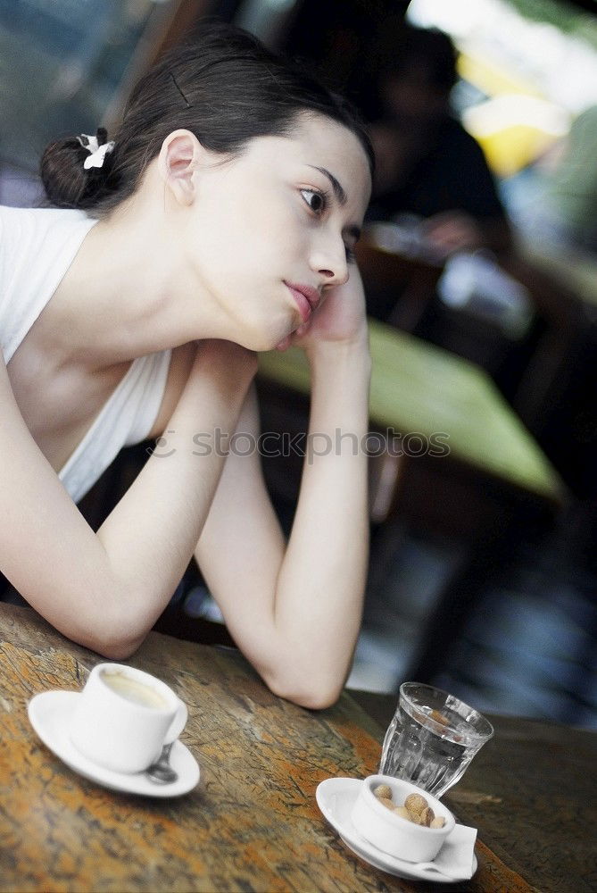 Similar – beauty girl sitting in a coffee shop with a cup in her hands